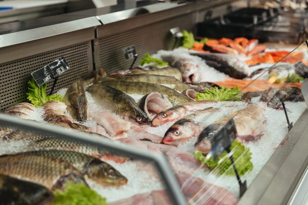 showcase with raw fish scaled